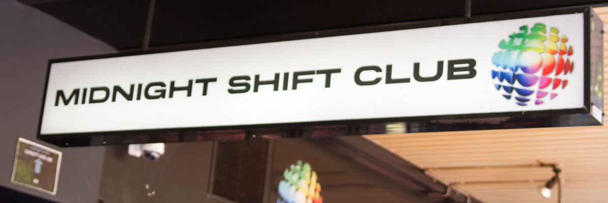 Midnight Shift Bar Under Awning Signage